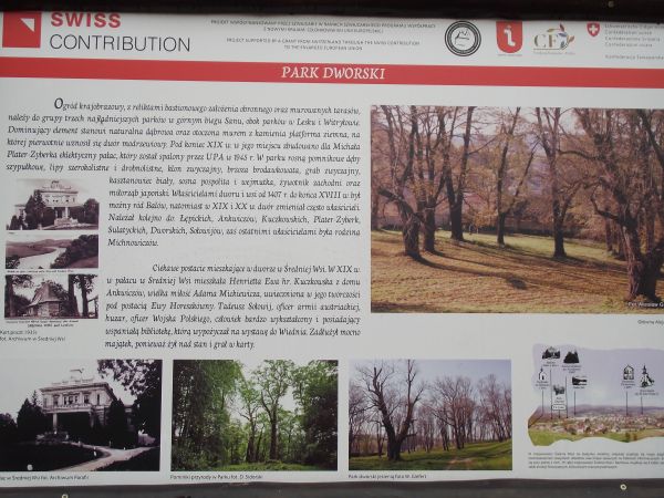 plansza z informacjami / przekazem dla turystów, zdjęcia dworu / pałacu, tam w 1-szej poł. XIXw. zamieszkiwała Ankwiczówna Henrietta Ewa - włoska miłość Adama M