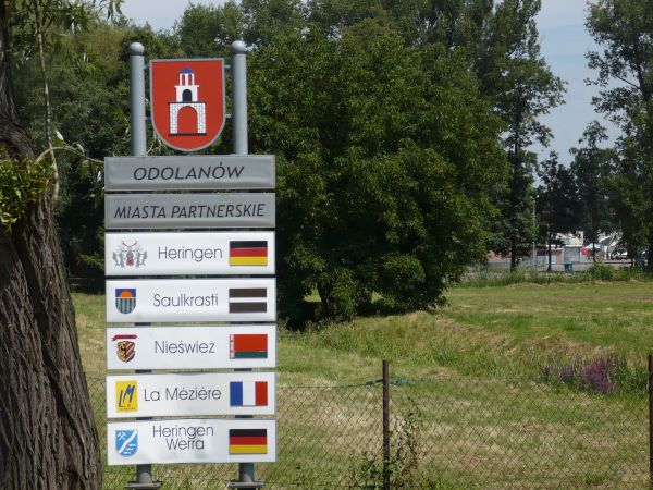 Herb Odolanowa i partnerskie miasta.