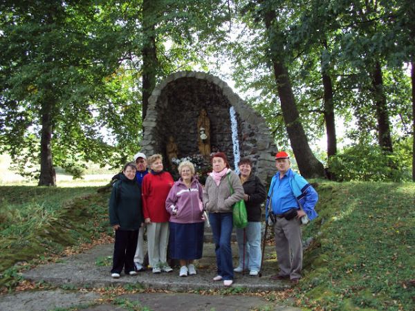Przed grotą - na wzgórzu - przy kościele.