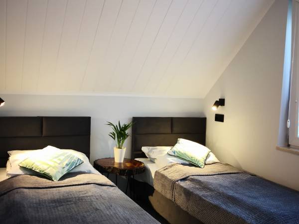 Gajówka - Całoroczne Pokoje i Apartamenty