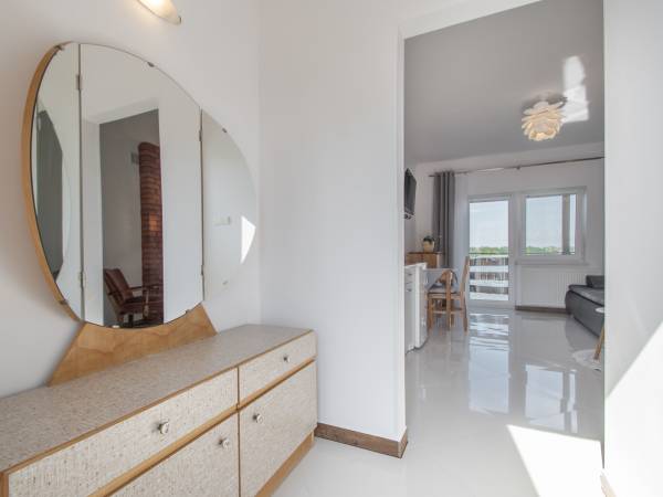 Apartamenty i Pokoje nad brzegiem jeziora Tałty