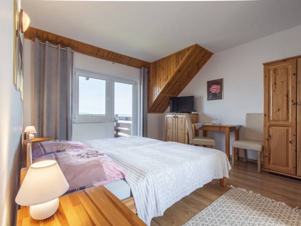 Apartamenty i Pokoje nad brzegiem jeziora Tałty