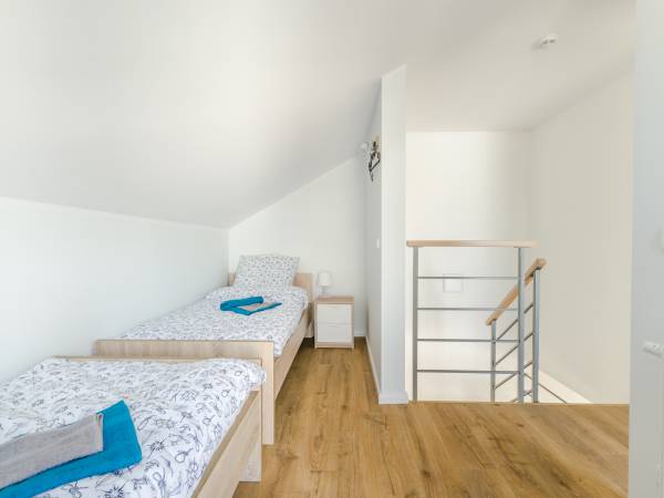 Każdy domek posiada jedną sypialnię otwartą