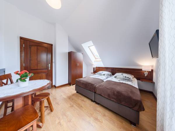 Pokoje i domki przy Leśniczówce