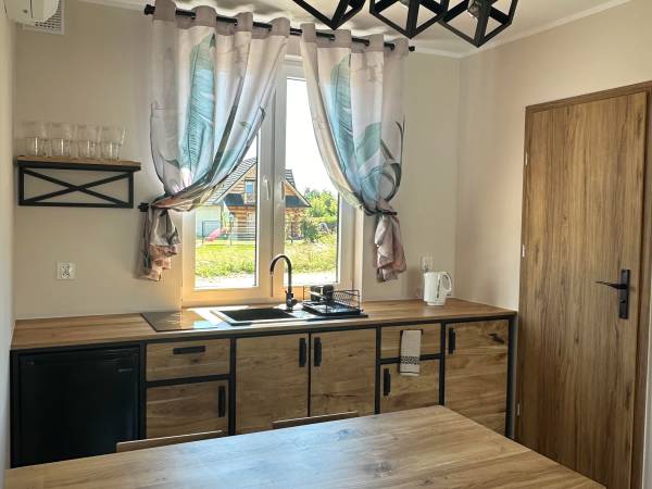 Domki Aurora klimatyzowane, z podgrzewanym basenem i zjeżdżalnią wodną