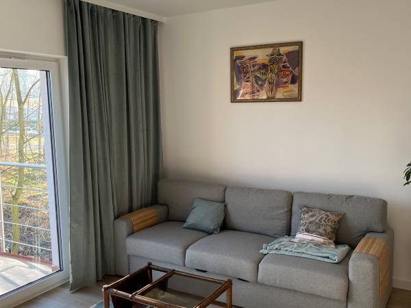 Sofa w salonie - Rozklada się na łozko