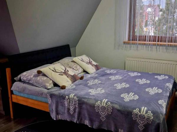 Sypialnia 1 w apartamencie 