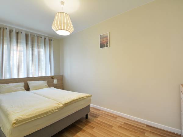 Sypialnia w apartamencie dla 4 osób